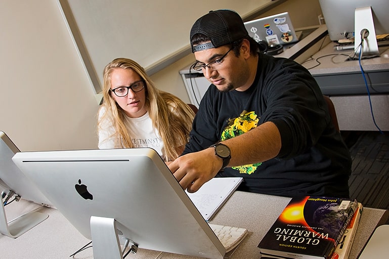 Two students on a computer