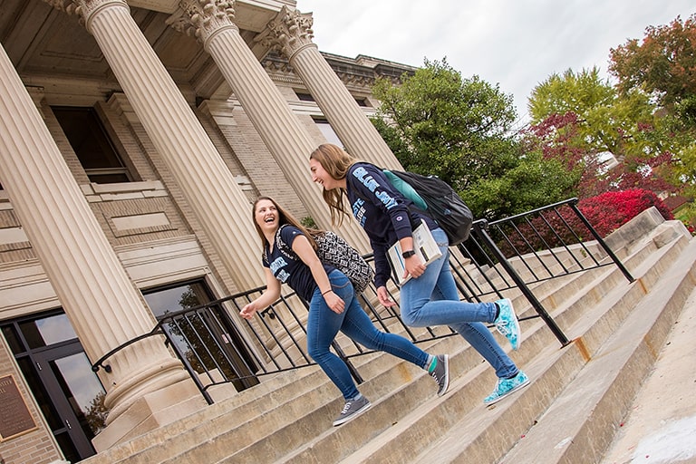 Two students running