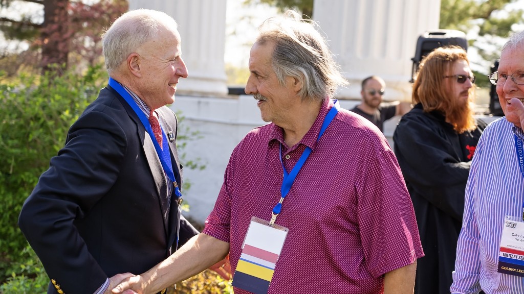 Alumni networking and reconnecting at a college event