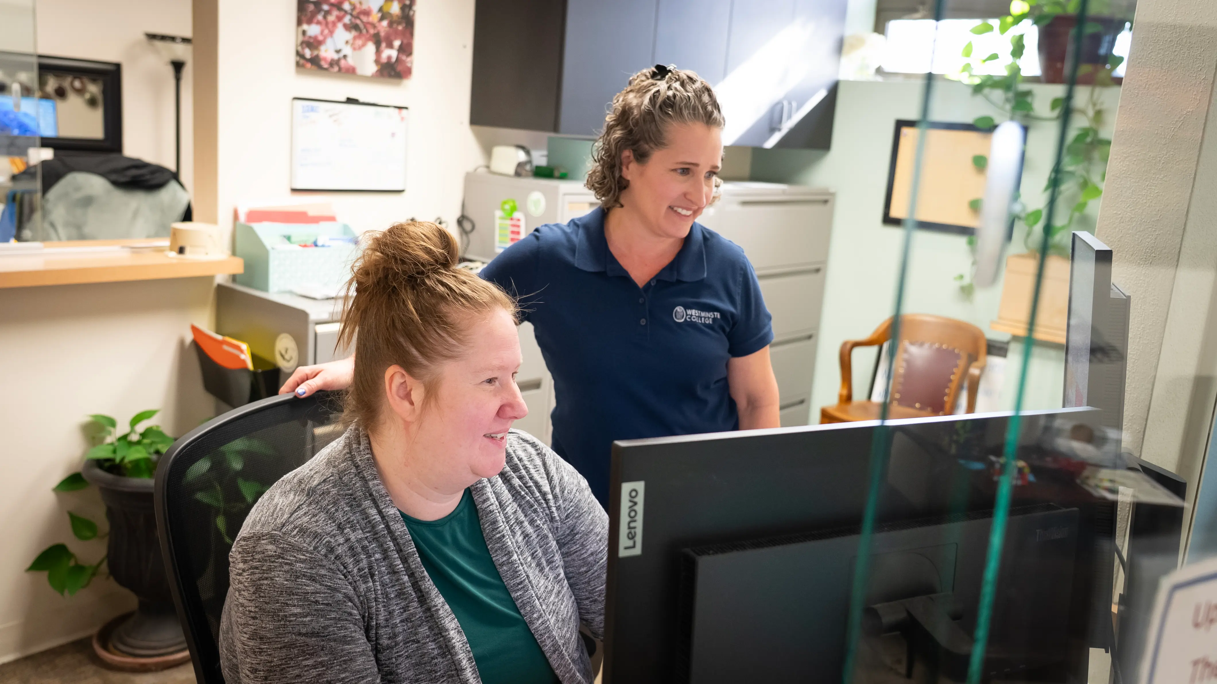 2 women from the wellness center staff looking on the right side of the screen
